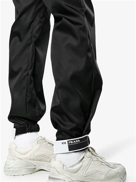 prada leg track pant|Prada black tracksuit.